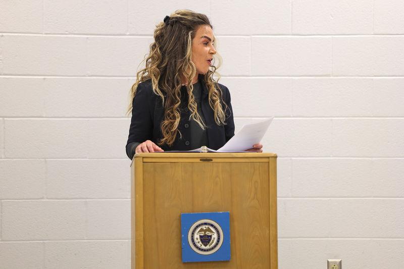 Kelly Shaw speaking at a podium