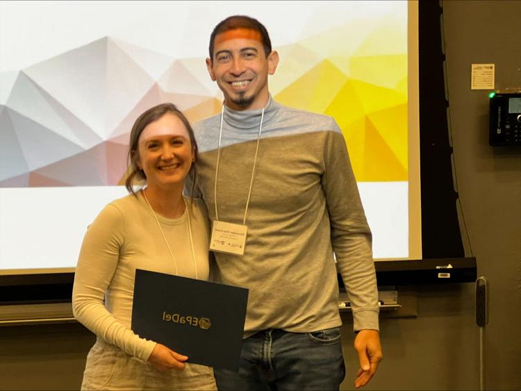 Samantha Pezzimenti holding certificate